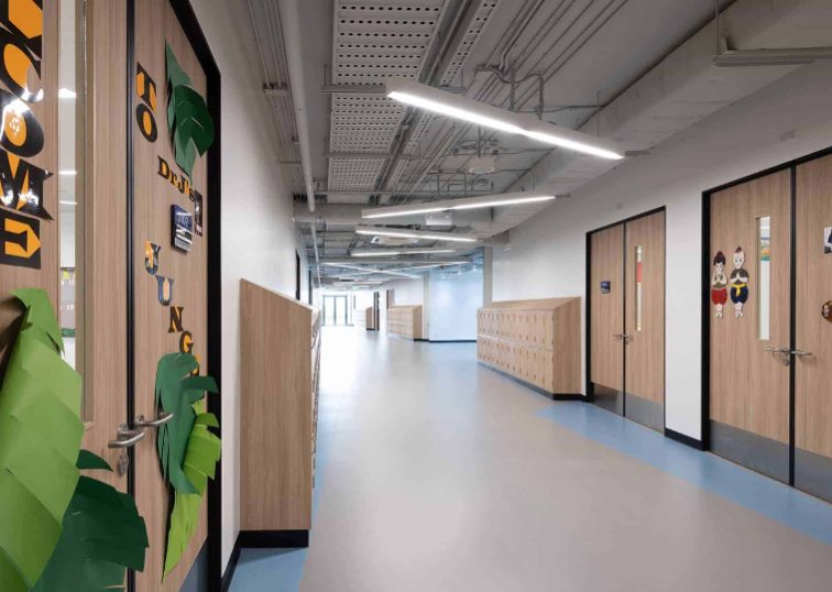 Bright school corridor with wooden lockers