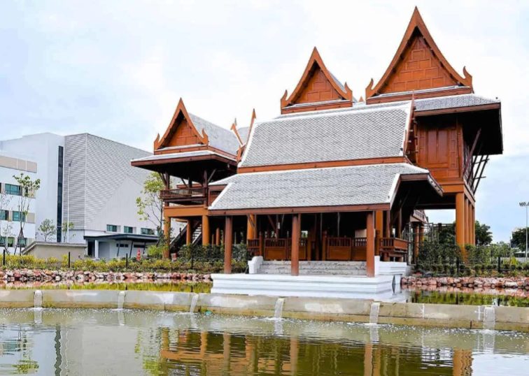 Traditional Thai pavilion beside a pond on campus